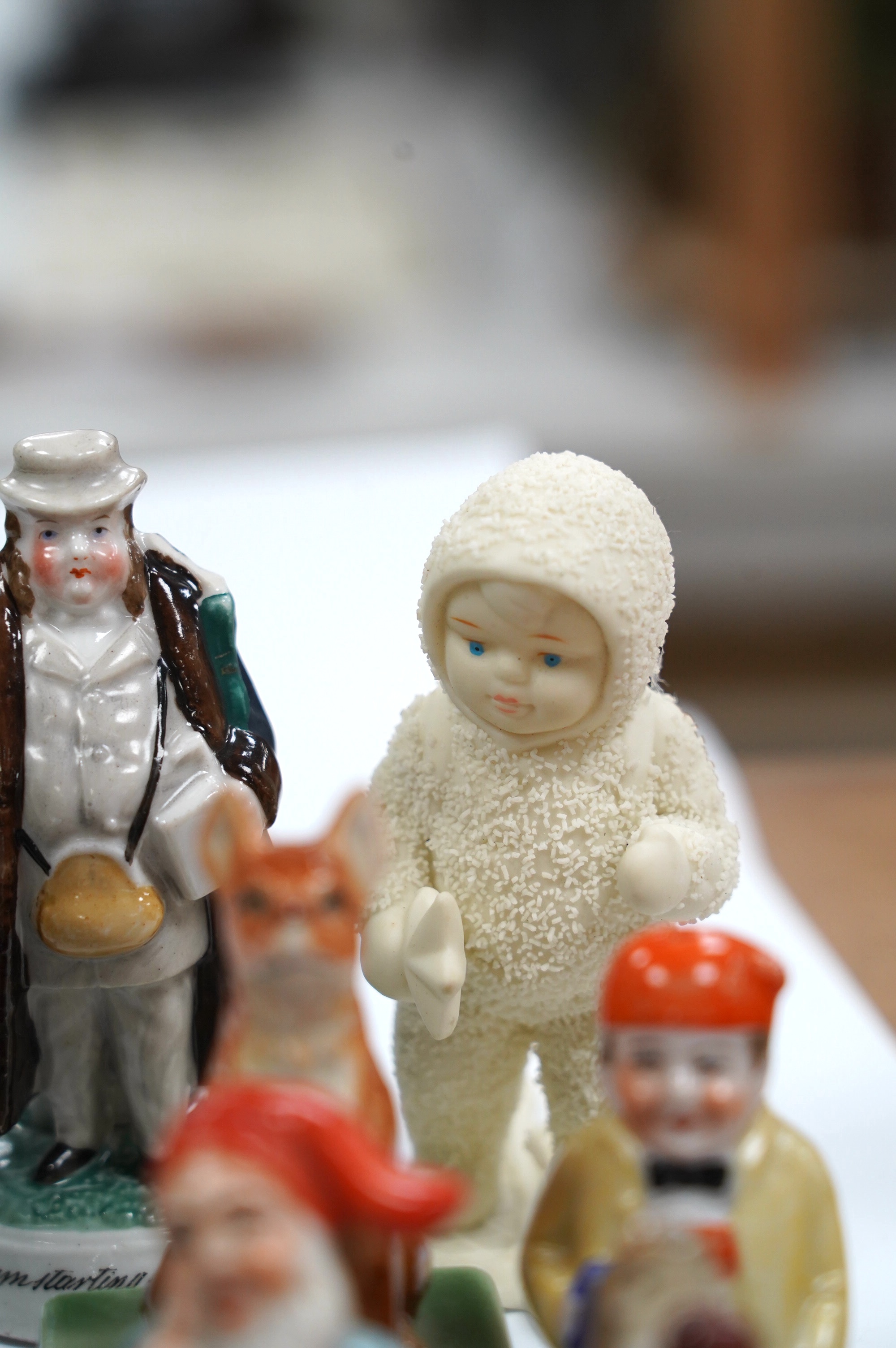 A box of small figures including Wade ceramics, Metzler & Ortloff, etc. highest 12.5cm (14). Condition - fair to good